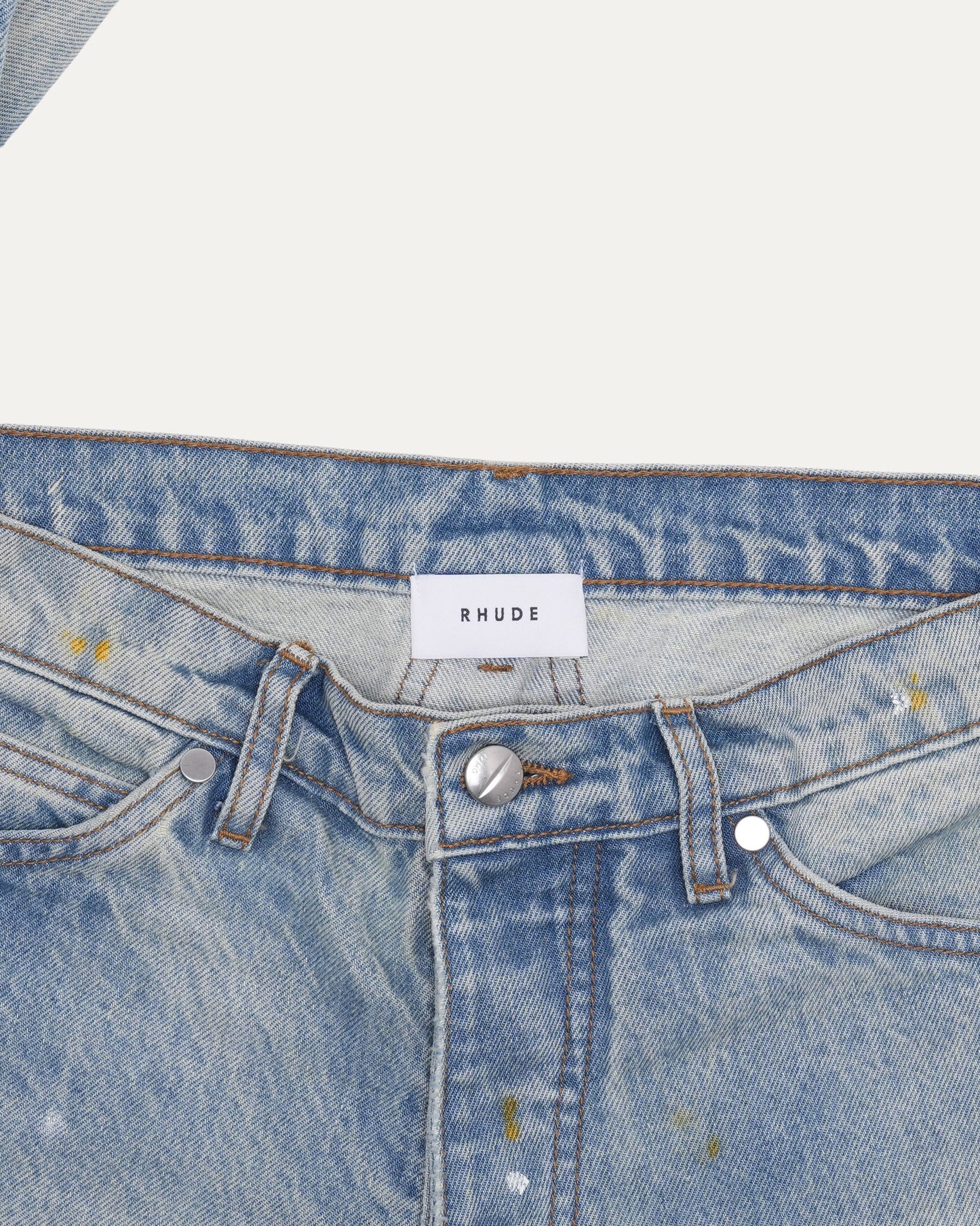 Distressed Button Hem Jeans