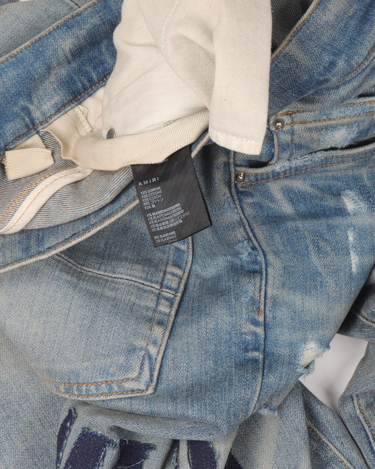 Distressed Repaired Denim Jeans with Logo