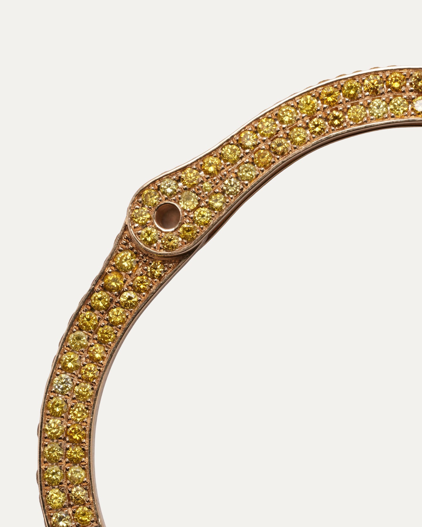 Pharrell's Gold and Yellow Diamond Handcuff Bracelet
