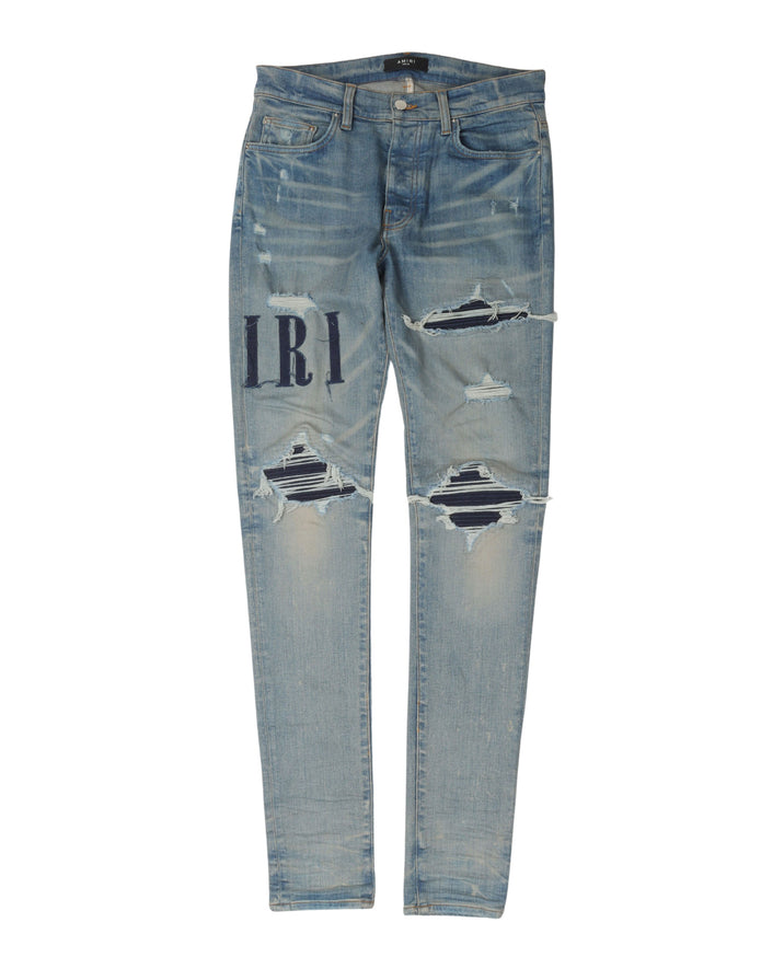 Distressed Repaired Denim Jeans with Logo
