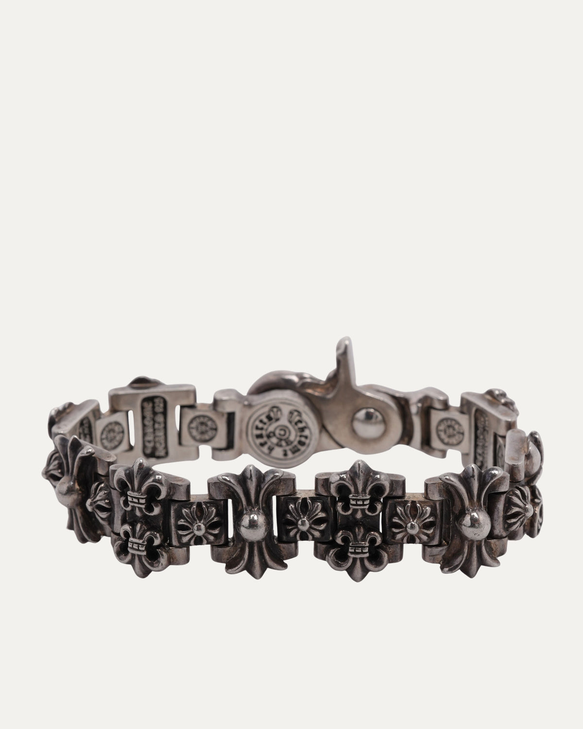 Fleur Lobster Clasp Multi Motif Bracelet