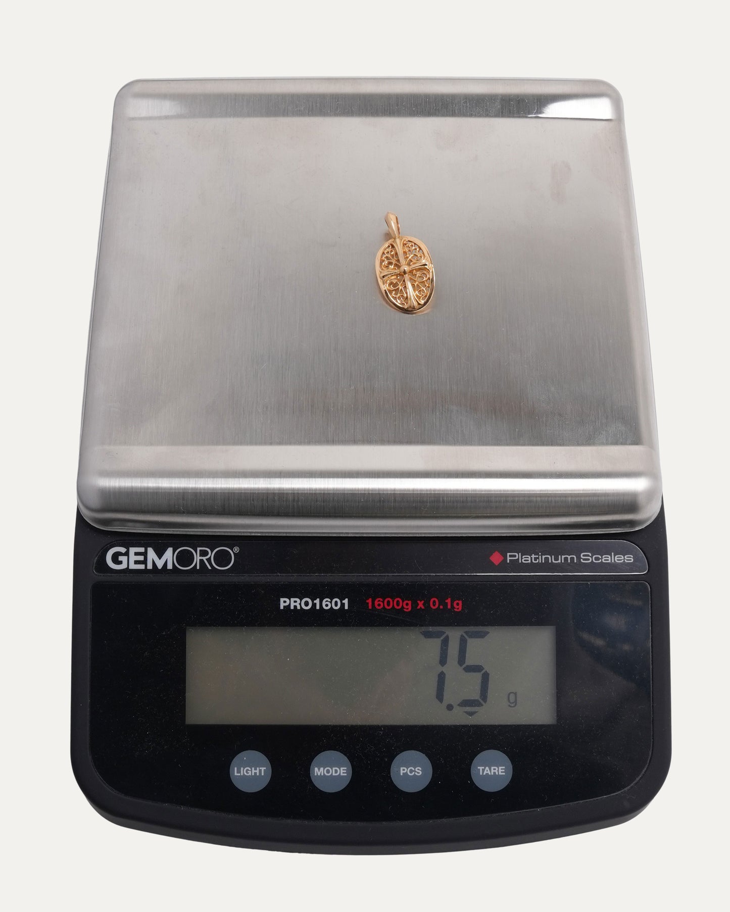 Gold Oval Cross Pendant