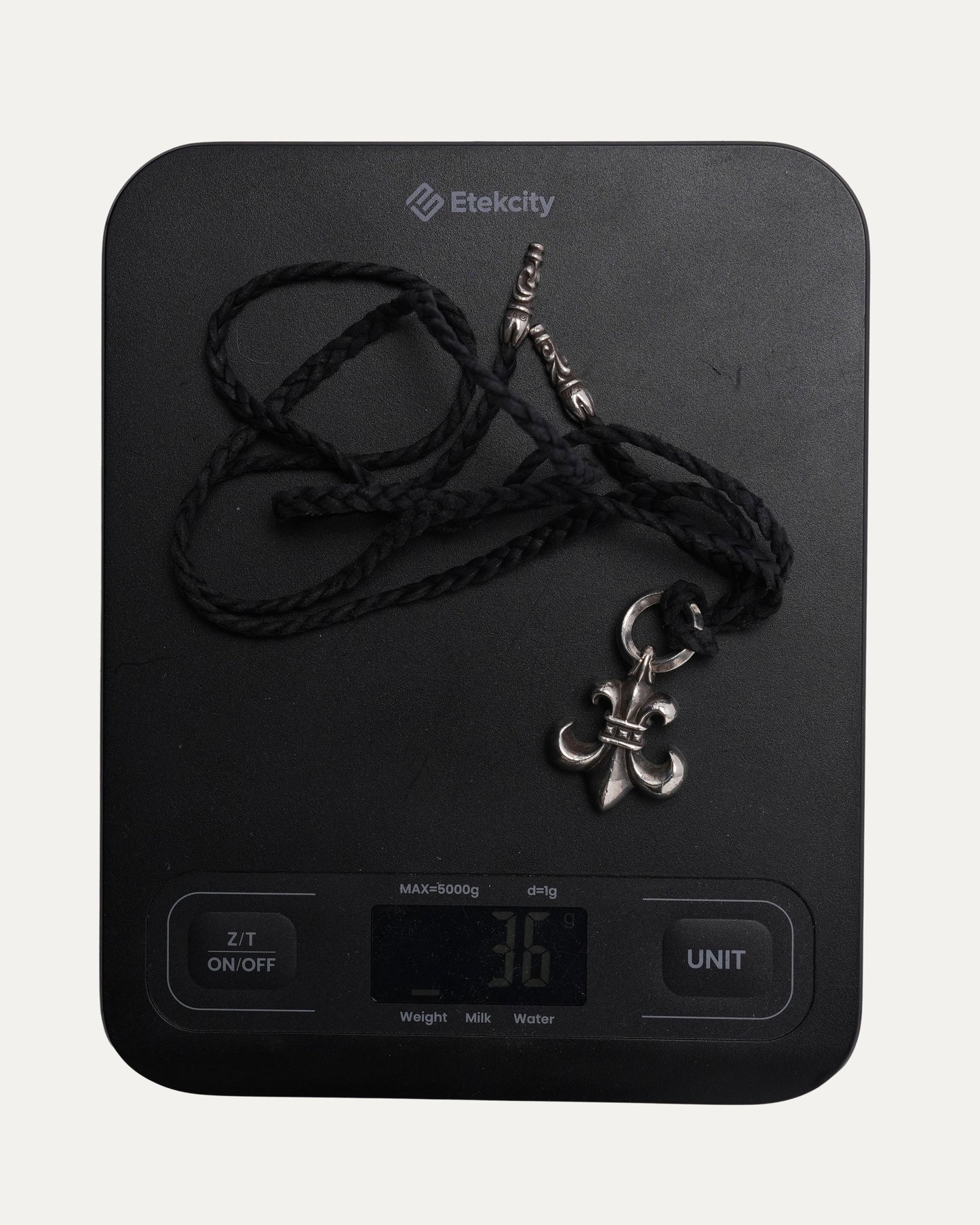 Fleur Pendant on Braided Leather Necklace