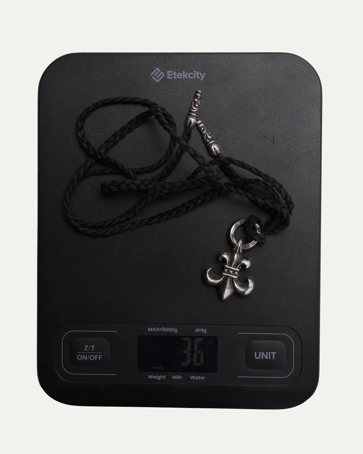 Fleur Pendant on Braided Leather Necklace