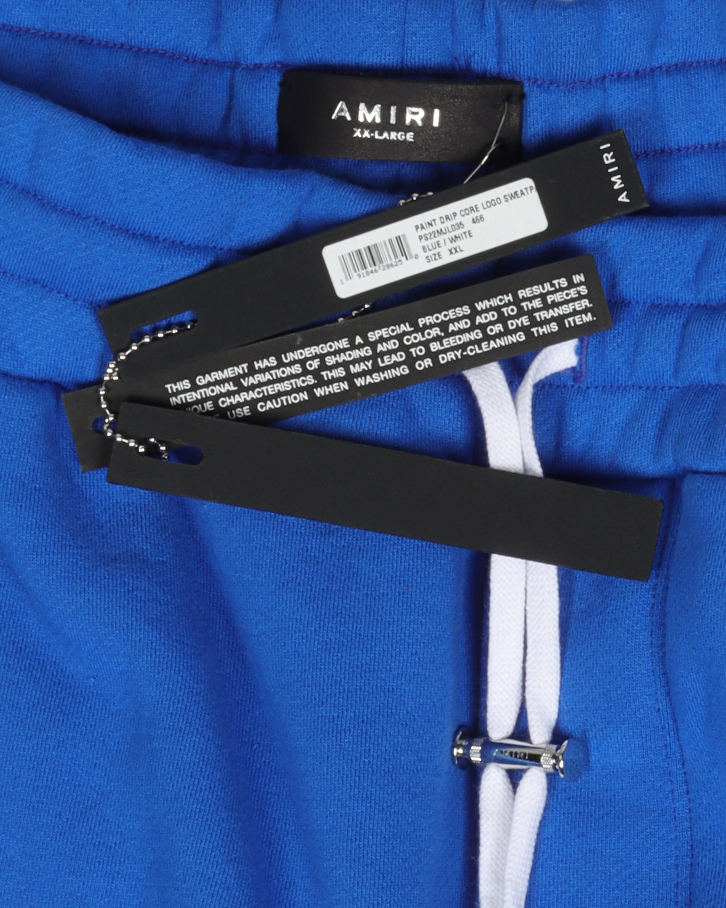 paint-drip logo track pants, AMIRI